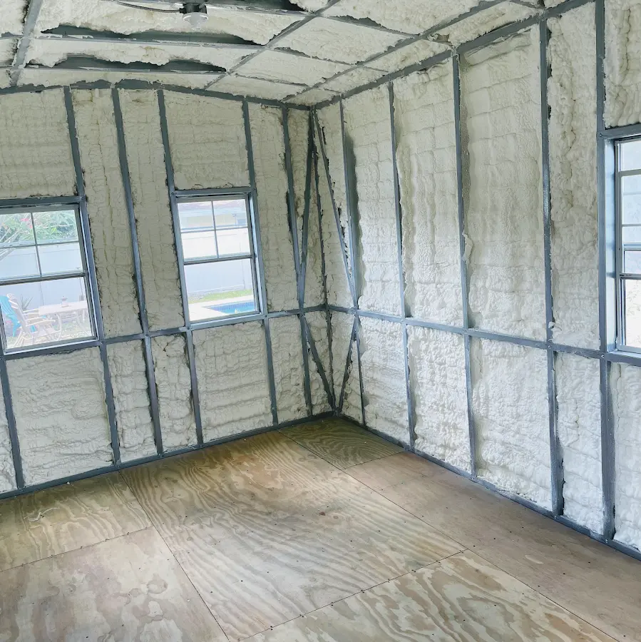 Closed-cell spray foam insulation applied to wall cavities in a residential project in Westville